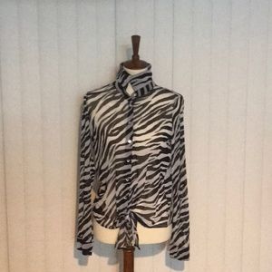 Inc black and white zebra print top.